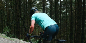 CHPT3 Women's Gravel Jersey in Aqua Teal being ridden through the forests of Wales